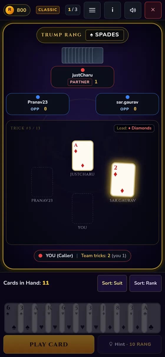 Rang Royale card table on a phone held upright, showing the trump suit, the four seats, the trick in the middle and the hand at the bottom